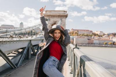 Blissful Girl in Red Sweater Dancing on Bridge in Autumn Morning – Free Download