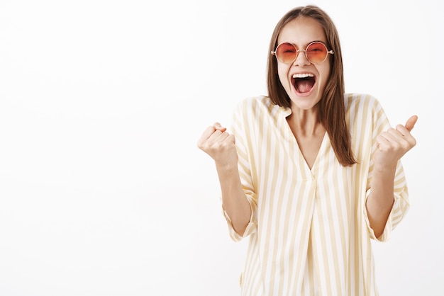 Excited Girl Celebrating Great News in Trendy Sunglasses and Blouse – Free Stock Photo, Download Free