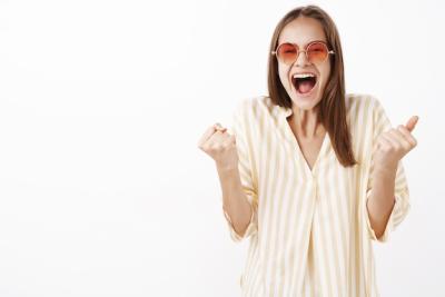 Excited Girl Celebrating Great News in Trendy Sunglasses and Blouse – Free Stock Photo, Download Free