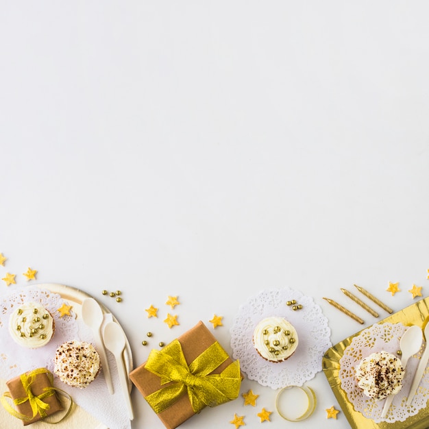 High Angle View of Muffins and Gifts on a White Backdrop – Free Download