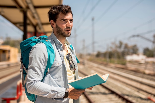 Traveler Waiting at a Train Station Platform – Free Stock Photo for Download