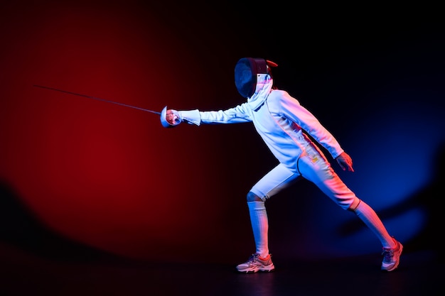 Fencing in Action: Young Woman in Special Equipment – Free Download