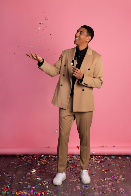 Man Playing with Confetti at a Party – Free Stock Photo for Download