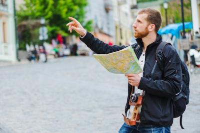 Man Navigating and Pointing with Camera – Free Stock Photo, Download Free