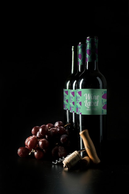 Wine Bottle Mockup Featuring Grapes – Free Download Stock Photo