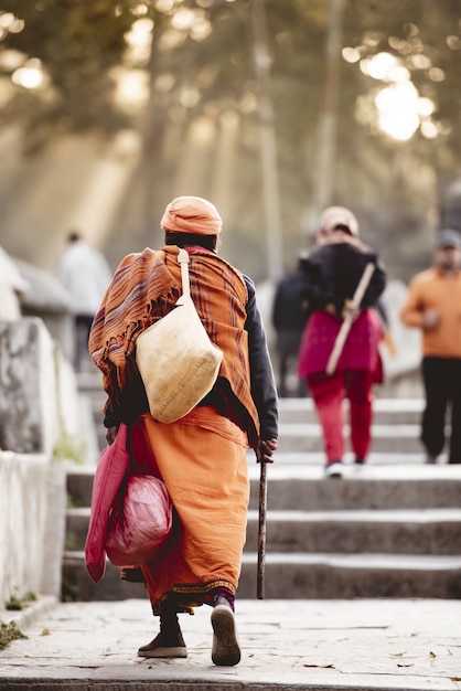 Hindu Robes on an Elderly Person in Vertical Shot – Free Stock Photo for Download