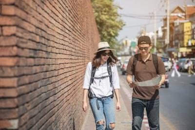 Asian Couple Tourist Holding City Map Crossing the Road – Free Download