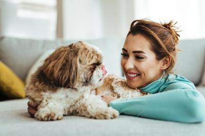 Happy Young Woman with Her Dog at Home – Free Download