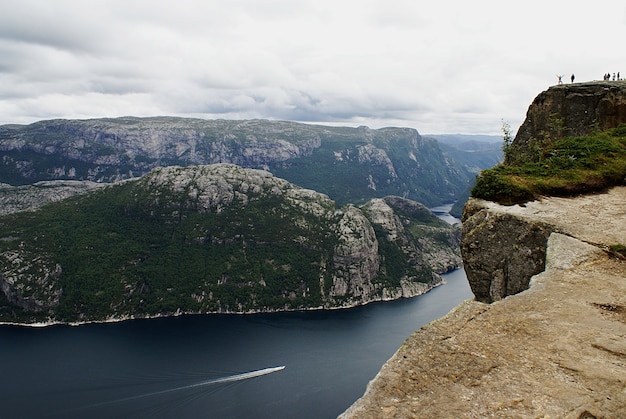 Stunning Views of Preikestolen Cliffs by the Lake in Stavanger, Norway – Free Download