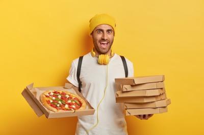 Cheerful Pizza Delivery Man with Carton Boxes, Music, and Yellow Hat – Free Stock Photo, Download for Free