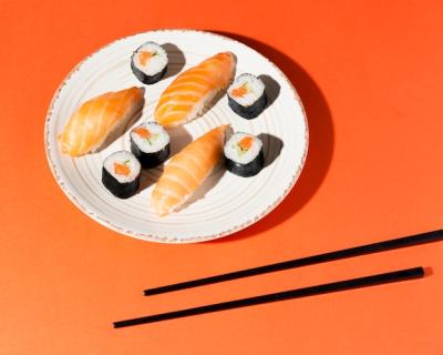 Delicious Sushi Variety Plate with Chopsticks – Free Download