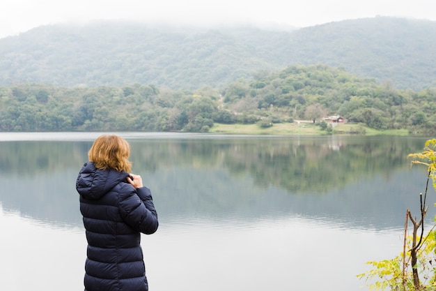 Scenic View of a Woman by the Lake – Free Stock Photo for Download