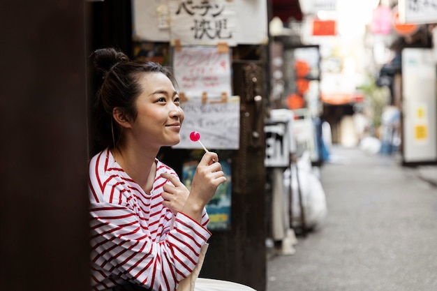 Young Woman Walking Through the Neighborhood – Free Stock Photo for Download