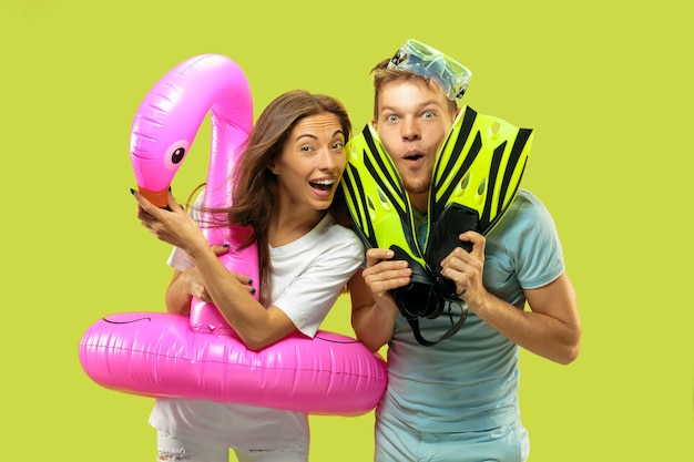 Beautiful Young Couple’s Portrait with Pink Flamingo Swimming Ring – Free Stock Photo, Download for Free