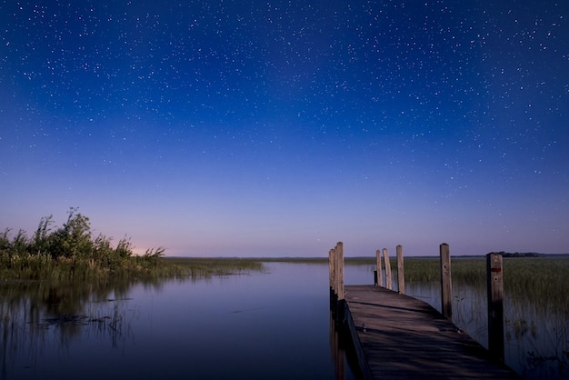 Brown Dock at Sunrise Over Water – Free Stock Photo for Download