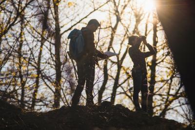 Travelers Exploring the Forest with Map and Binoculars – Free Stock Photo for Download