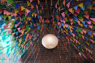 Colorful Buntings and Lighting Equipment Hanging from Ceiling – Free Download