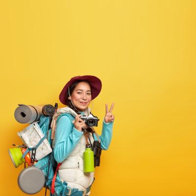 Active Female Traveler with Retro Camera and Rucksack â Free Stock Photo Download