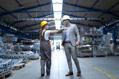 People at Work Greeting Each Other with Elbow Bump Amidst the Coronavirus Pandemic – Free Stock Photo for Download