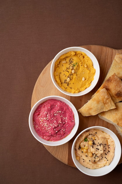 Colorful and Tasty Hummus with Ingredients – Free Download