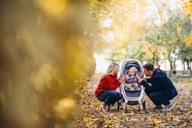 Family Strolling with Baby Daughter in an Autumn Park – Free Download