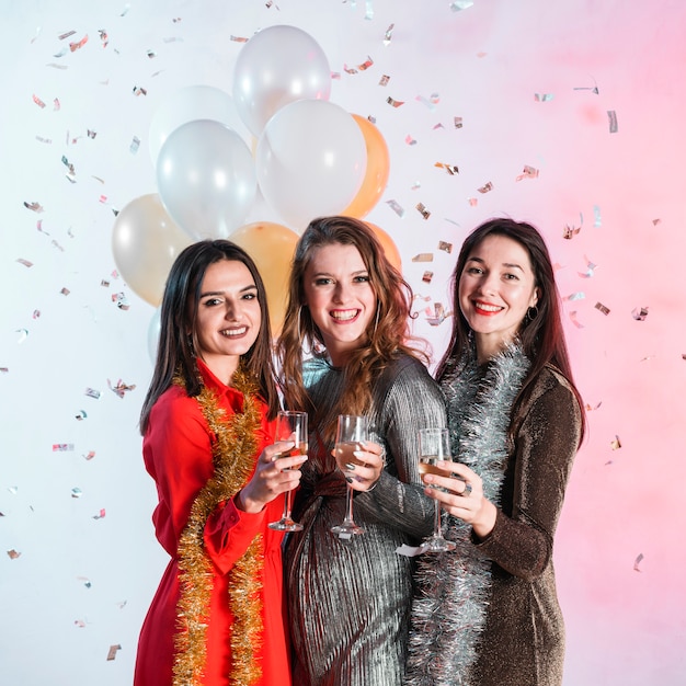 Women Holding Champagne Glasses – Free Download