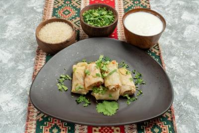 Appetizing Stuffed Cabbage Dish with Rice, Herbs, and Sour Cream – Free Download