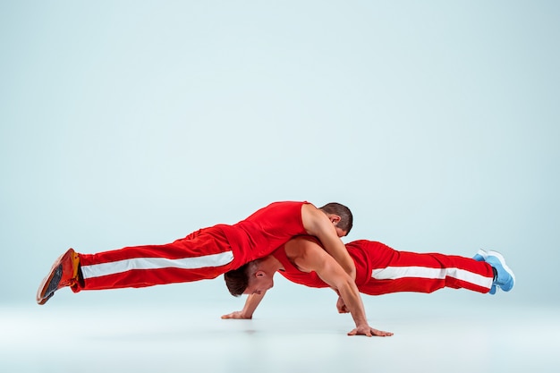 Two Gymnastic Acrobatic Caucasian Men in Balance Pose – Free Download