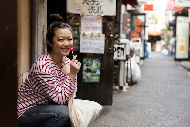 Young Woman Walking Through the Neighborhood – Free Download