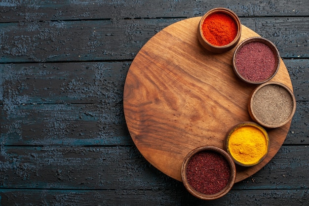 Different Seasonings on Dark Desk – Free Stock Photo Download