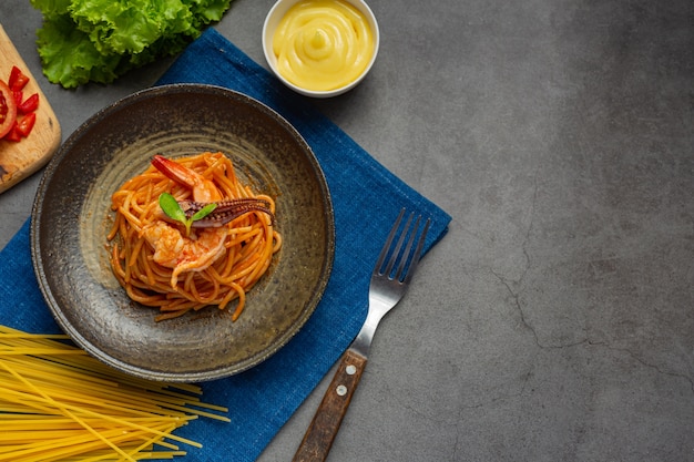 Spaghetti Seafood with Tomato Sauce and Beautiful Ingredients – Free Download