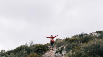 Female Hiker on Mountain Top with Outstretched Hands – Free Download