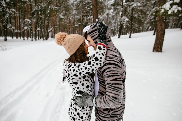 Beautiful Couple in Animal Costumes in a Winter Forest – Free Download