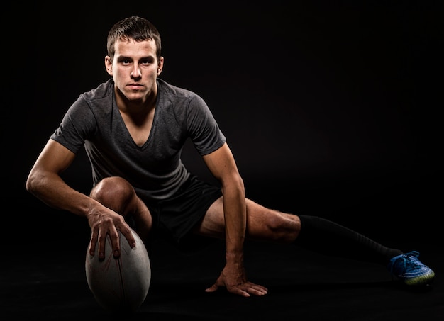 Athletic Handsome Rugby Player Holding Ball – Free Stock Photo for Download