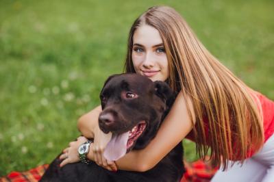 The Young Beautiful Girl Hugs Her Dog in the Garden – Free Stock Photo, Download Free Stock Photo