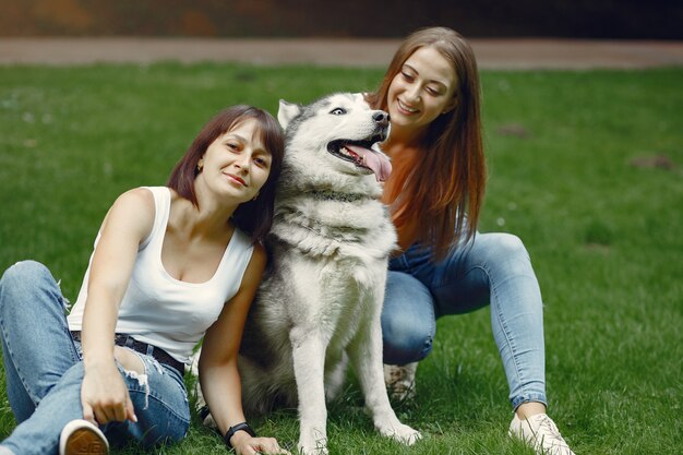 Women Enjoying Spring Park Time with a Adorable Dog – Free Stock Photo for Download