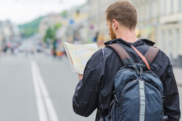 Traveller with Map: Free Stock Photo for Download