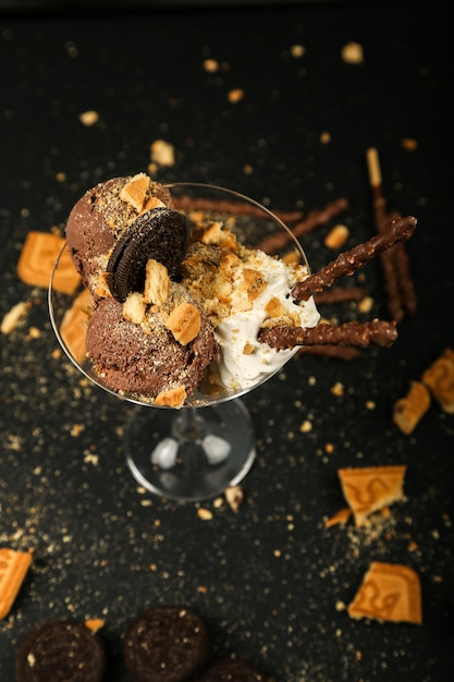 Chocolate Chip Cookies with Whipped Cream and Chocolate Sticks on Black Table – Free Download