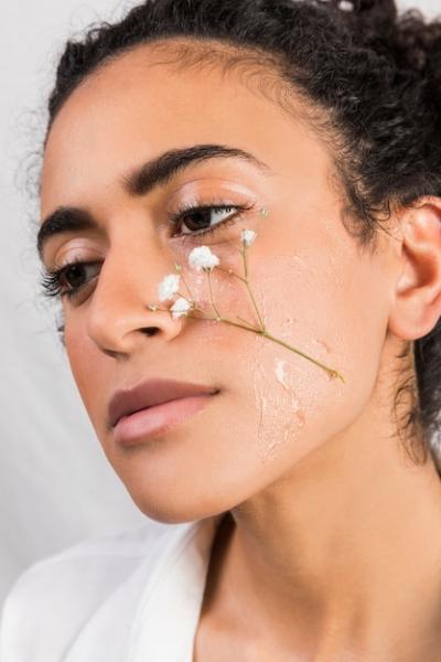 Tender Woman with Wet Flower on Face – Free Stock Photo for Download