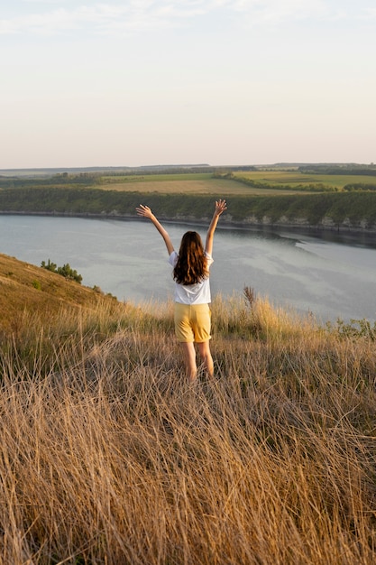 Back View of a Woman with Arms Raised – Free Stock Photo, Download Free