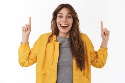 Happy Caucasian Girl Smiling and Pointing at Exciting Offer – Free Stock Photo, Download for Free