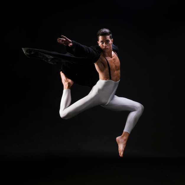 Young Athletic Male Jumping and Dancing in Stylish Clothes – Free Download