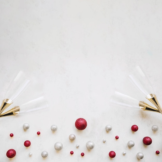 Celebrate New Year with Festive Background, Balls, and Glasses – Free Download