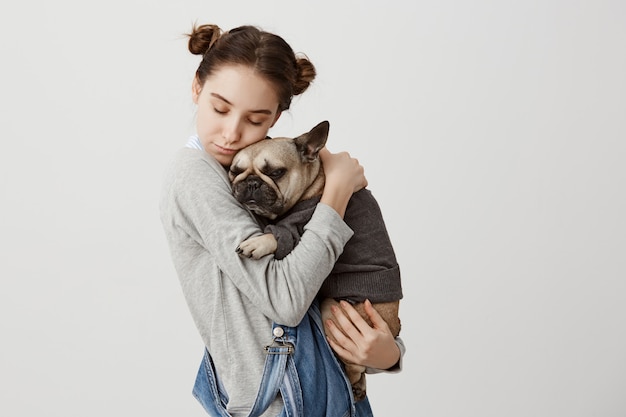 Headshot of a Caucasian Woman Cuddling Her Pet Dog: Tender Emotions & Love Concept – Free Download