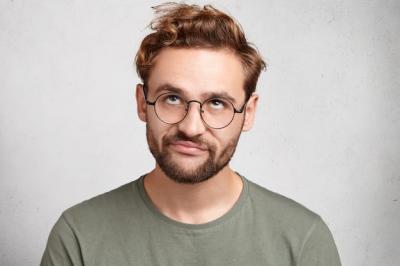 Bearded Young Man Indoor Portrait with Trendy Hairstyle – Free Download