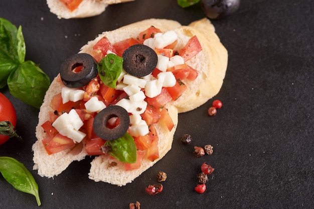 Bruschetta with Tomatoes, Mozzarella Cheese, and Basil – Traditional Italian Antipasto Free Download