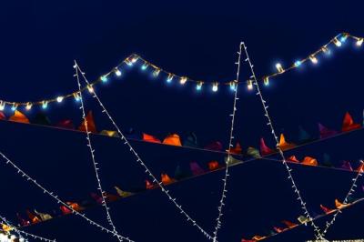 Colorful Glowing Flags and Garlands Against a Dark Blue Sky – Free Stock Photo Download