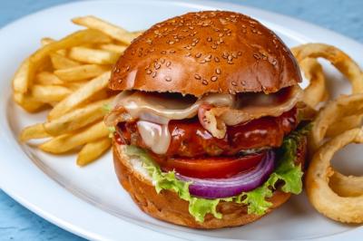 Side View Hamburger with Grilled Beef Patty, Bacon, Cheese, Lettuce, Red Onion, Tomato, and French Fries – Download Free Stock Photo