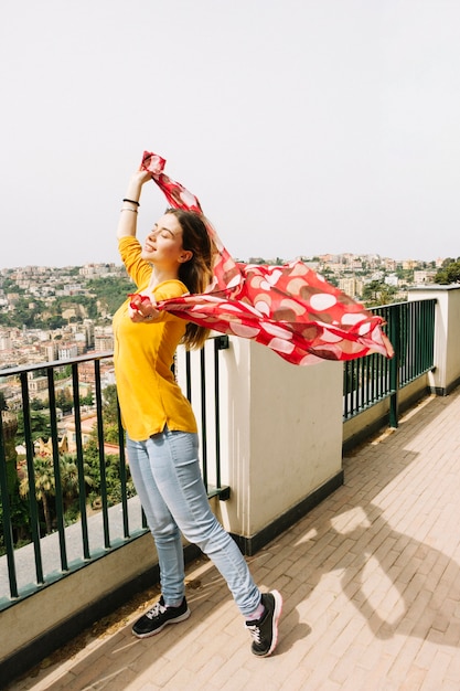 Woman with Red Scarf Enjoying the Wind – Free Stock Photo for Download