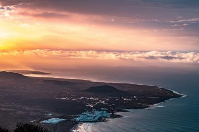 Aerial Shot of a Beautiful Coastal City Seashore with Amazing Clouds and Sunlight – Free Download